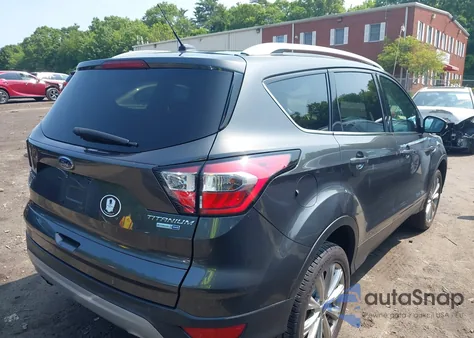 2017 Ford Escape Titanium z USA, uszkodzony, nr VIN 1FMCU9J99HUE27597